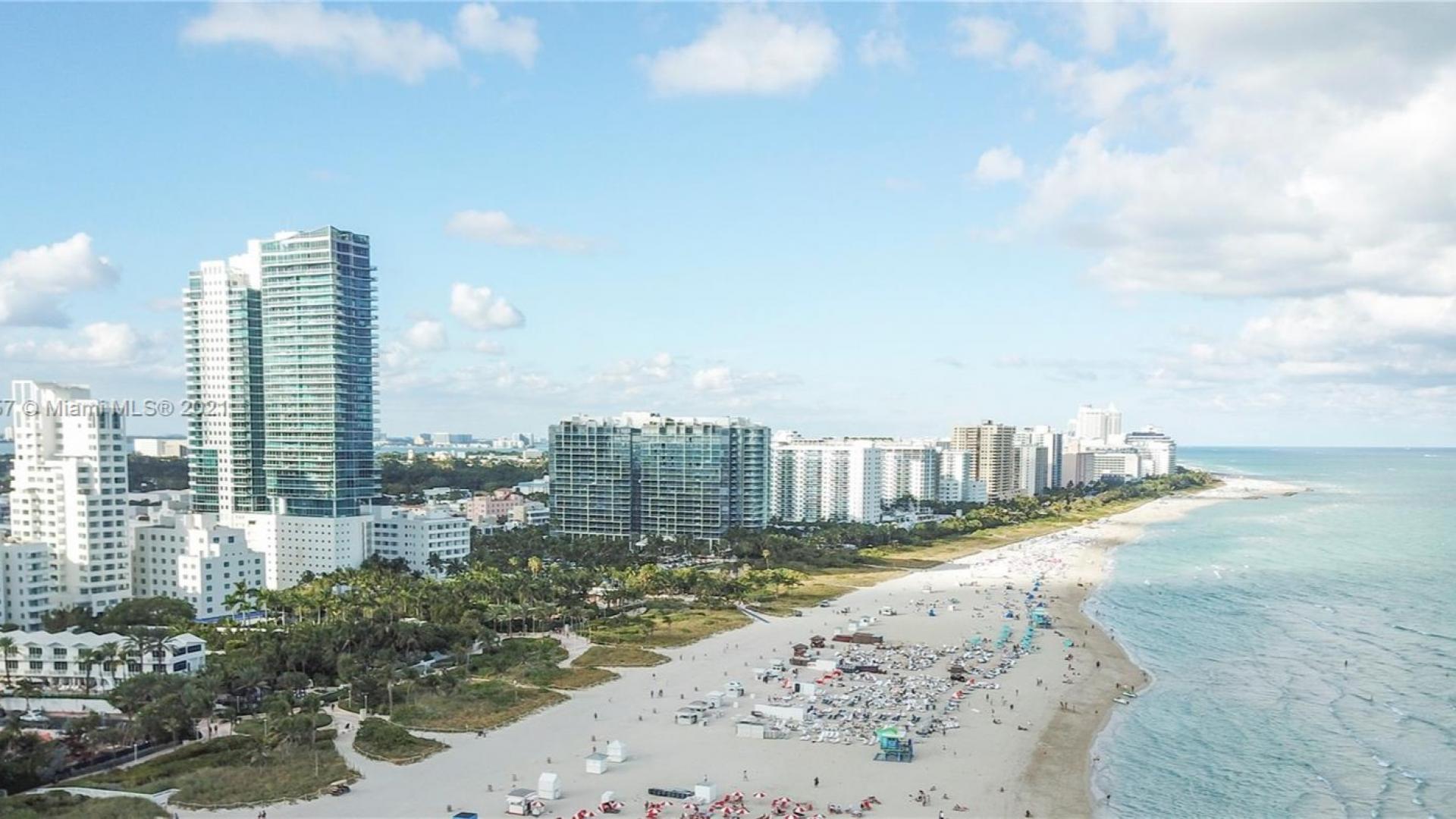 Luxurious Miami villa living room with ocean view, modern decor, and large windows